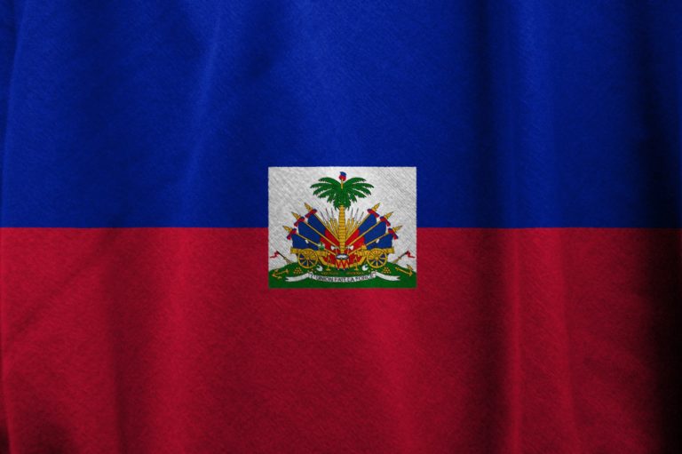 One of the facts on Haiti is its bicolor flag bearing a coat of arms