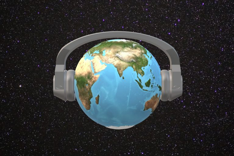 Headphones on a globe, with the music of India being front and center