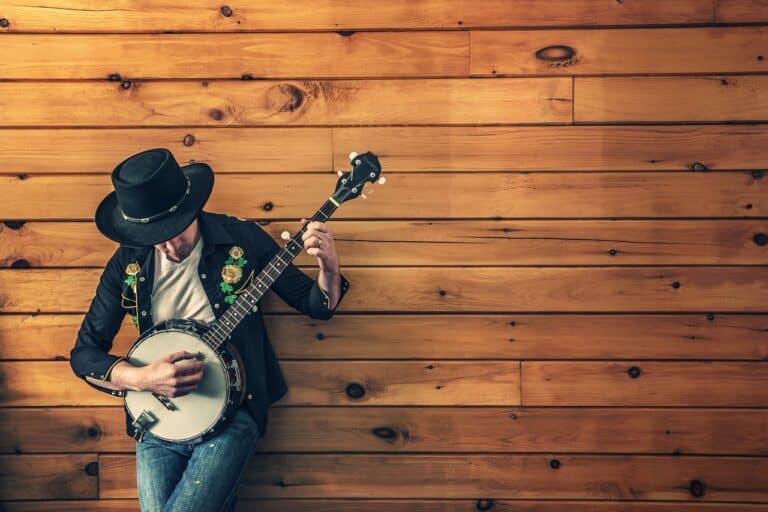 A musician with a banjo singing country music