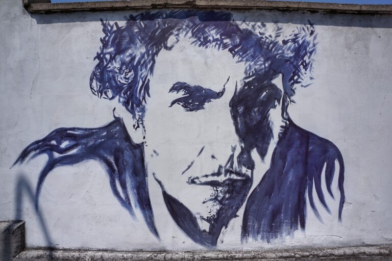 A black and white mural of Bob Dylan