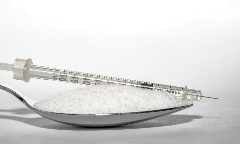 Sugar and an insulin syringe, the latter important for treating diabetes and kidney disease