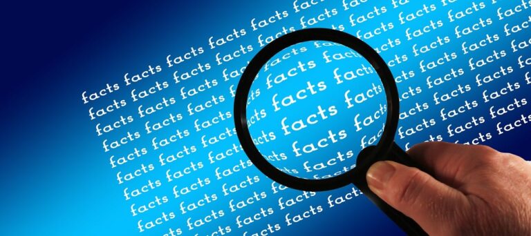 A magnifying glass identifying facts, just like the book Factfulness did